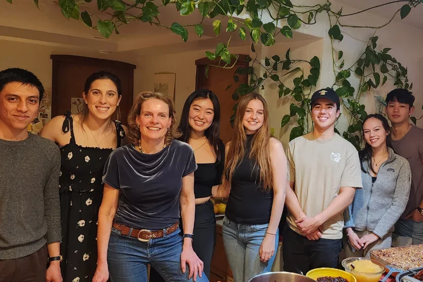 Group standing by table at Christmas Goose dinner.
