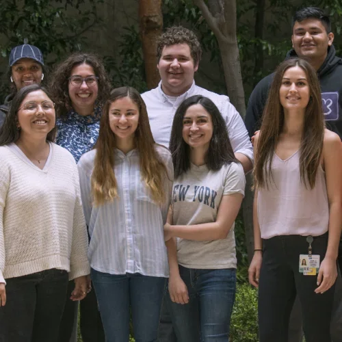 Jonathan Lopez, Hana Abdirahman, Victoria Parrilli, Andrew Kamali, Kunal Ranat, Salma Arredondo, Rochelle Bitolas, Linda Tajalli, Izzy Bonacorsi and Ina Wanner in front of the Gordon Neuroscience Research Building at the UCLA medical campus in 2019. 