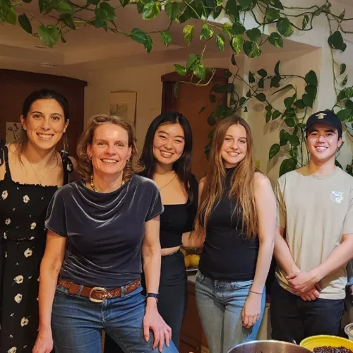 Group standing by table at Christmas Goose dinner.