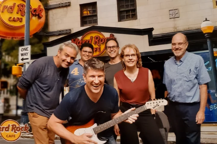 Russell Huie, Javier Allende Labastida, Adam Ferguson, Ina Wanner, Ray Koehler and Mark Burns of the TOP-NT Consortium having dinner at the Hardrock Café in Atlantat during the National Neurotrauma Symposium 2022.