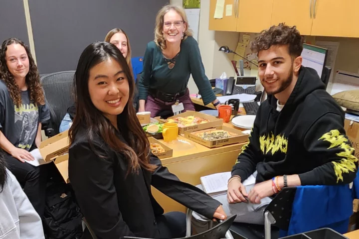 Human trauma model image analysis team: Jenny Richmond, Michelle Gong, Aaron Soghomonian, Ina Wanner, Chloe McMannChapman; Maddie Klee during office -pizza dinner in April, 2023.