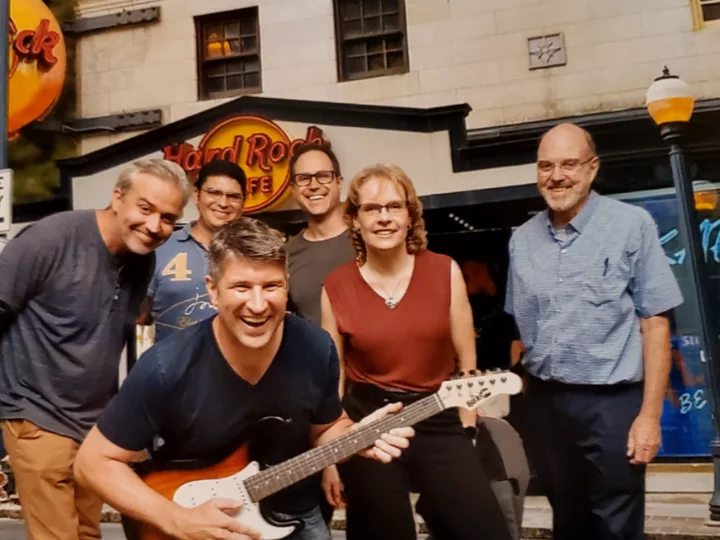 Russell Huie, Javier Allende Labastida, Adam Ferguson, Ina Wanner, Ray Koehler and Mark Burns of the TOP-NT Consortium having dinner at the Hardrock Café in Atlantat during the National Neurotrauma Symposium 2022.